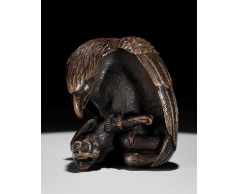 NOBUKAZU: A FINE WOOD NETSUKE OF AN EAGLE ATTACKING A MONKEYBy Nobukazu, signed Nobukazu 信一 to 刀Japan, 19th century, Edo peri