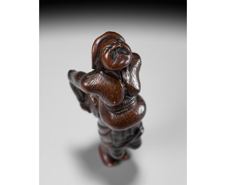 A LARGE WOOD NETSUKE OF A DUTCHMAN WITH A DRUMUnsignedJapan, 18th century, Edo period (1615-1868)A large and boldly carved wo