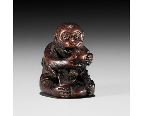 BUNCHO: A FINE WOOD NETSUKE OF A MONKEY EATING PERSIMMONSBy Buncho, signed Buncho 文蝶Japan, 19th century, Edo period (1615-186