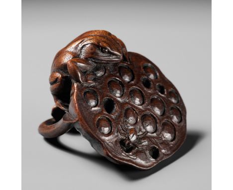 A RARE WOOD NETSUKE OF A FROG HUNTING A SPIDER ON A LOTUS PODUnsignedJapan, 19th century, Edo period (1615-1868)Finely carved