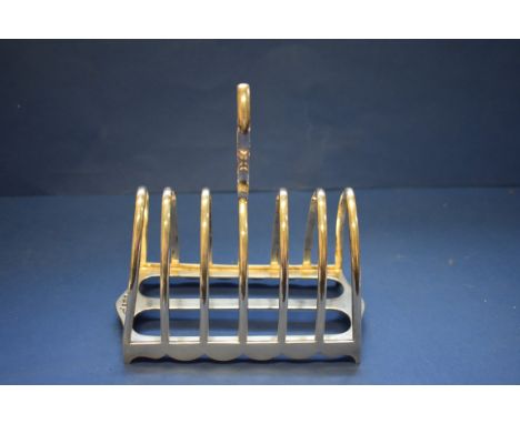 An Edwardian silver six section arched toast rack, by Walker &amp; Hall Ltd, Sheffield 1909, 14.5cm, 278g. 