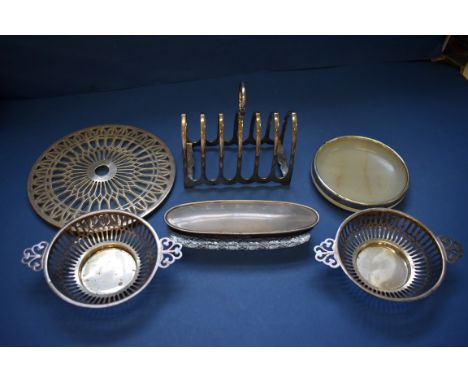 A silver six section toast rack, by Atkin Bros,&nbsp;Sheffield 1930; together with a pair of silver pierced dishes; and three
