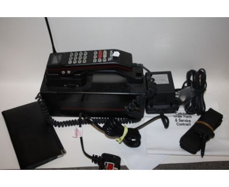 A VINTAGE BRITISH TELECOM CELLULAR TELEPHONE WITH PAPERWORK