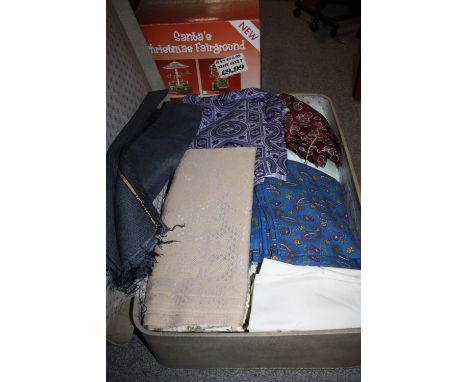 A SUITCASE OF VINTAGE TEXTILES AND FABRIC