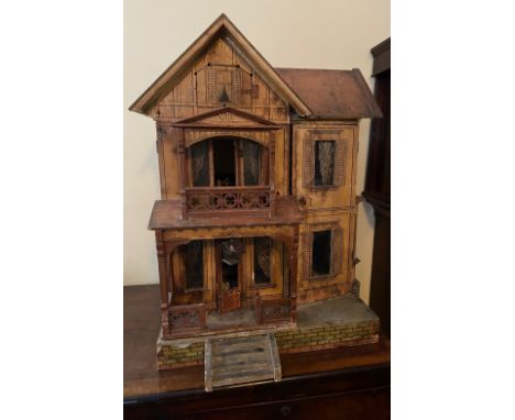 A VINTAGE MORITZ GOTTSCHALK DOLLS HOUSE - GERMAN CIRCA 1900, the chromolithographed facade with left front verandah opening t