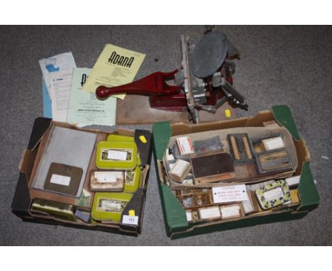 A VINTAGE ADANA FIVE-THREE PRINTING MACHINE WITH TWO BOXES OF PRINTING BLOCKS AND INSTRUCTIONS
