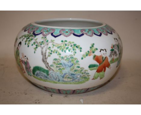 AN ORIENTAL CHINESE STYLE LOW BOWL,  with scenes of children playing and flying kites, character mark to base, Dia 28 cm