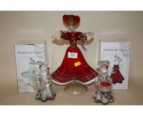 A MURANO STYLE STUDIO GLASS FIGURE OF A LADY IN A RED DRESS TOGETHER WITH TWO BOXED 'AMELIA ART GLASS' ANGELIC TEA LIGHT HOLD