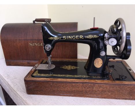 A VINTAGE SINGER SEWING MACHINE