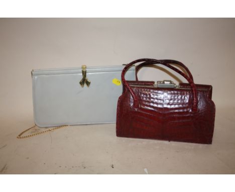 A VINTAGE RED CROCODILE SKIN EFFECT HANDBAG, TOGETHER WITH A GREY LEATHER EVENING BAG