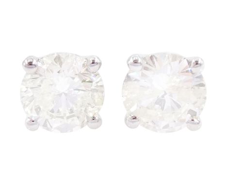 Pair of 18ct white gold round brilliant cut diamond stud earrings, stamped 750, total diamond weight approx 1.05 caratConditi