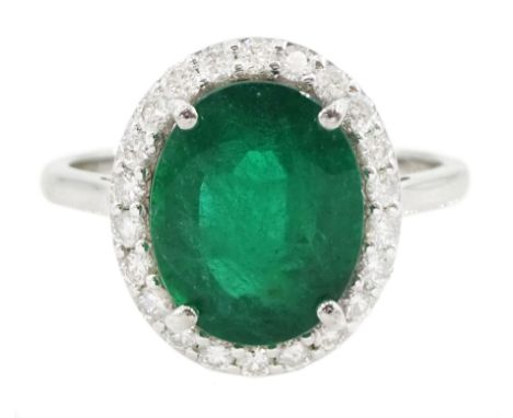 18ct white gold oval cut emerald and round brilliant cut diamond cluster ring, hallmarked, total emerald weight 3.33 carat, t