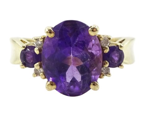 9ct gold three stone amethyst and four stone diamond ring, hallmarkedCondition Report:Approx 2.7gm, size I-J