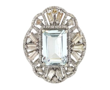 Large silver aquamarine and diamond pierced design ring, the central emerald cut aquamarine of approx 3.75 carat, with baguet