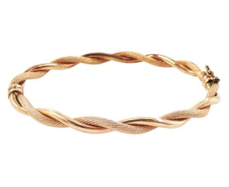 9ct rose gold textured and polished hinged bangle, hallmarkedCondition Report:Approx 5.1gm, inner circumference = 18cm, coupl