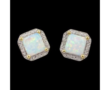 Pair of 9ct gold opal and diamond stud earrings, stamped 375Condition Report:Approx 1.6gm, diameter = 7.9mm