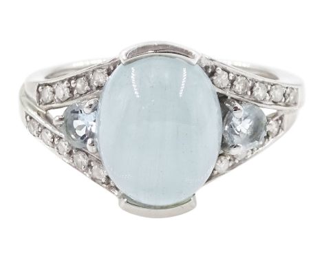 9ct white gold three stone oval cabochon and round cut aquamarine and round brilliant cut diamond ring, hallmarkedCondition R