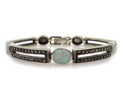 Silver opal and marcasite link bracelet, stamped 925Condition Report:Length = 19cm, link depth = 0.75cm, good condition