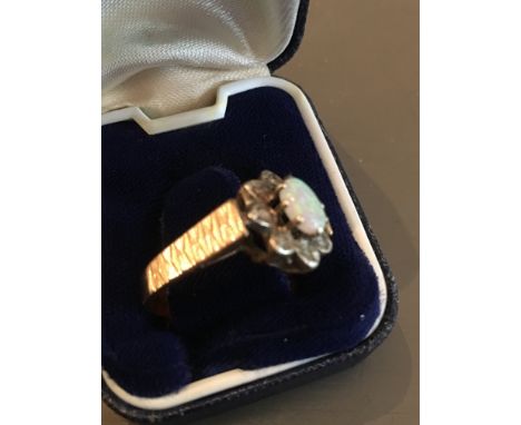 A opal, diamond and 9ct gold ring (Total weight 4g)