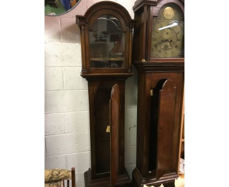 A Longcase clock in mahogany in need of restoration with face and works 