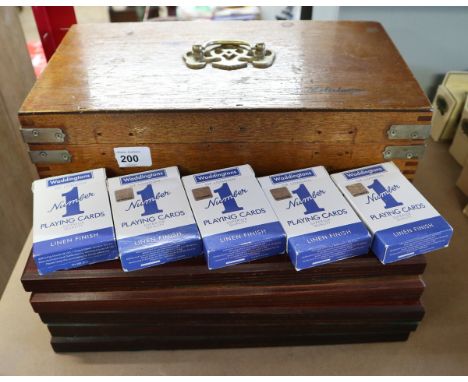 Wooden box containing playing cards and cribbage boards 