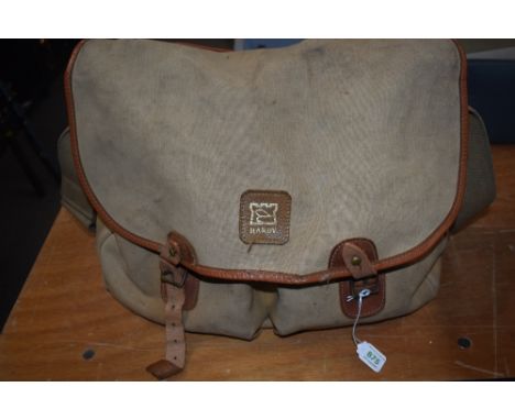 A canvas Hardy fishing bag with some general fishing tackle inside 34cm x 38cm approx