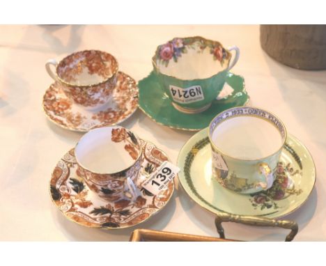 Four cups and saucers including Paragon and Aynsley 