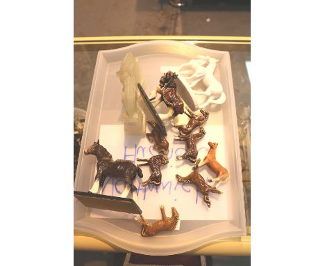 Collection of ceramic horse figures and a pair of carved soapstone horse bookends 