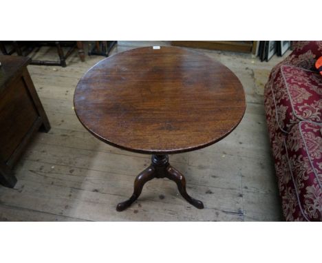 A George III mahogany circular tilt-top tripod table, 66cm diameter.