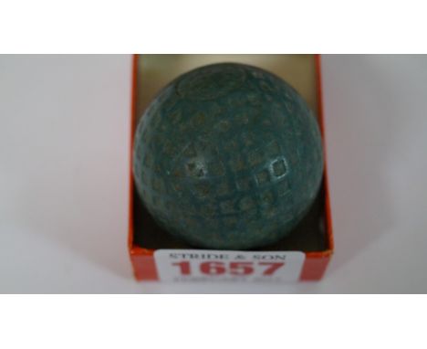 A scarce vintage green golf ball, probably a Dunlop Warwick, with square dimples, approx 40mm diameter. 