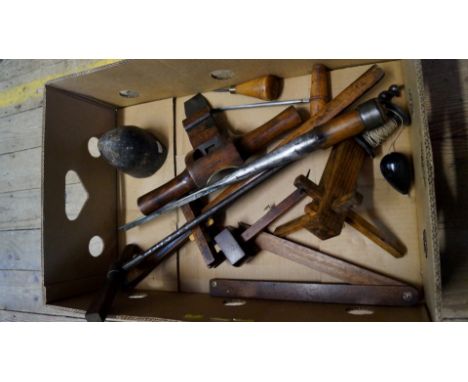 Tools: a collection of wheelwright's tools, to include: a mullingstone; a brass faced jarvis, by Buck; a bruz by Marples & So