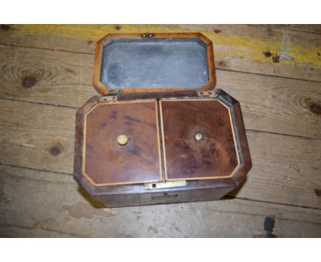 A George III burr yew wood and line inlaid tea caddy of chamfered rectangular form, 19cm wide. 