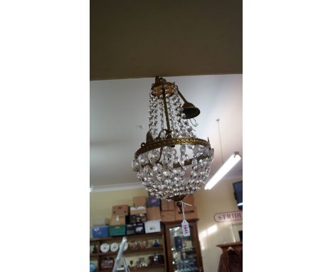 An old faceted bead and brass bag chandelier; together with another coloured faceted bead four branch ceiling light.