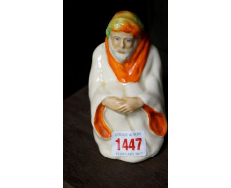 A scarce Wilkinson pottery figure of an Arab, 11.5cm high.    Condition Report:  No visible sign of chips, cracks or repair s