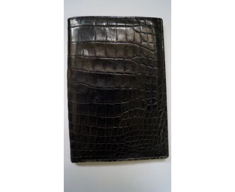 A vintage Asprey black snakeskin travel wallet.