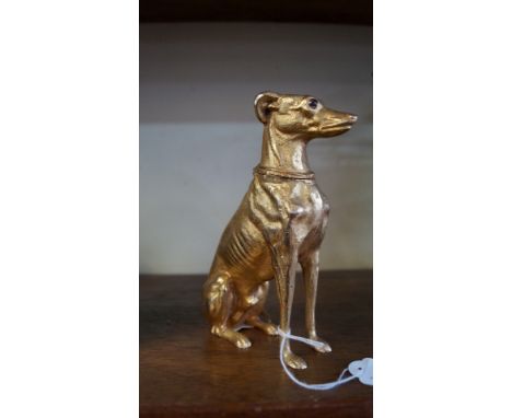 A gilt brass hound inkwell, with inset eyes and hinged neck, 16cm high. 