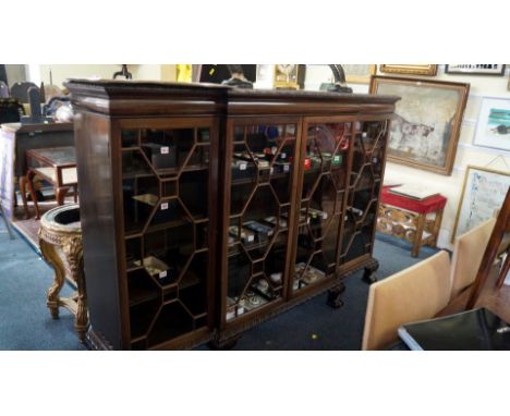 An early 20th century, carved mahogany breakfront bookcase, 183cm wide.    Condition Report:  Top has a crack at rear  right 