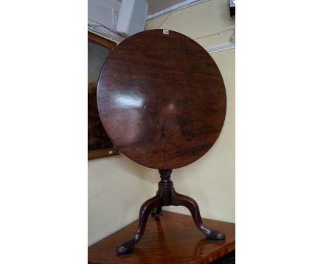 A George III mahogany circular tilt-top tripod table, with single piece top and birdcage action, 76cm diameter. 