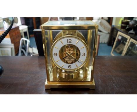 A Jaeger LeCoultre brass Atmos clock, circa 1950s, No.191929, 22.5cm high.    Condition Report:  working order, condition of 