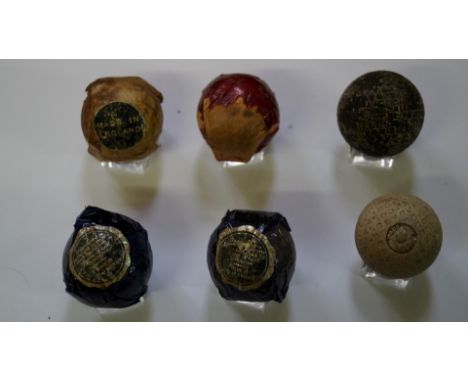 A collection of six vintage golf balls, four in original wrappers. 