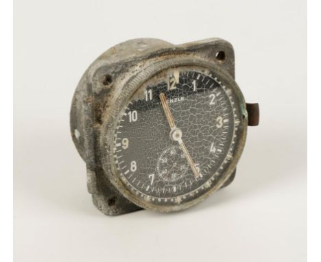 A SECOND WORLD WAR NAZI COCKPIT CLOCK, by Kienzle, with black dial. 