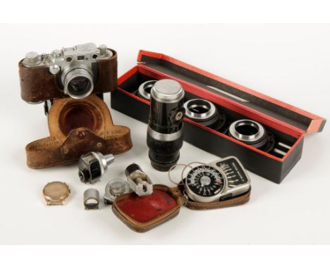 A LEICA D.R.P. CAMERA, no. 362366, in a leather case with accessories and other related items. The Leica items were acquired 