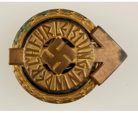 A SECOND WORLD WAR NAZI SPORTS LEADER BADGE, impressed (11461), with raised RZ over M and M 1/101 marks. 50mm wide.