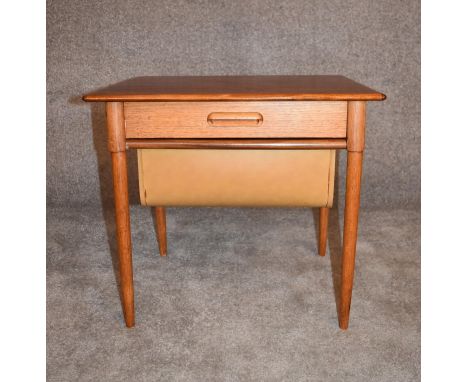 A 1970's vintage teak work table fitted slide out sewing basket on tapering supports. H.50 x 57cm 