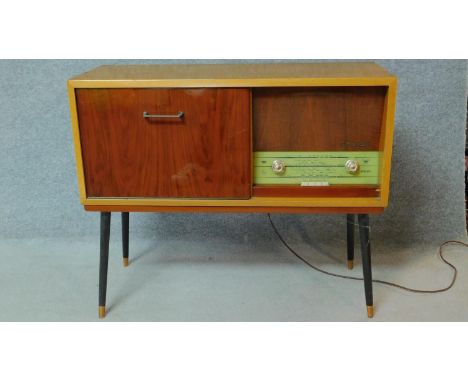 A 1960's vintage satin walnut and teak dancette supports radiogram, by Philips. H.76 W.92 D.36 
