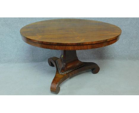 A Regency rosewood circular tilt top loo table on pedestal tripod base. H.73 L.123 W.123cm 