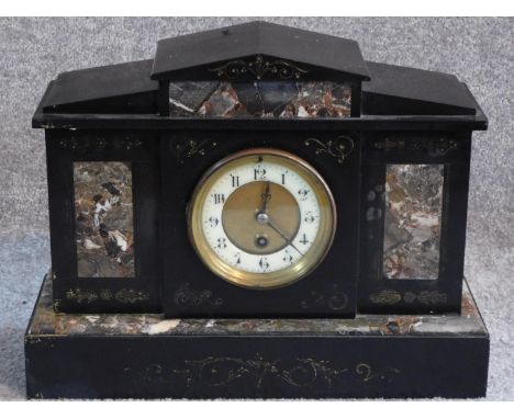 A Victorian style black slate and marble mantle clock. With white enamel and brass dial. Engraved scrolling details. H.29 W.3
