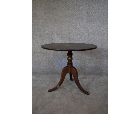 A 19th century oak circular occasional table on tripod cabriole supports. H.52 x 60cm 