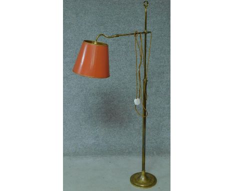A vintage brass adjustable floor lamp on pedestal base. H.138cm