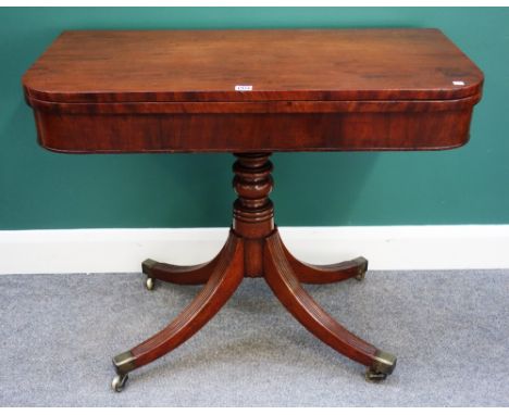 A George III mahogany card table, the D shaped top on turned column and four downswept supports, 92cm wide.